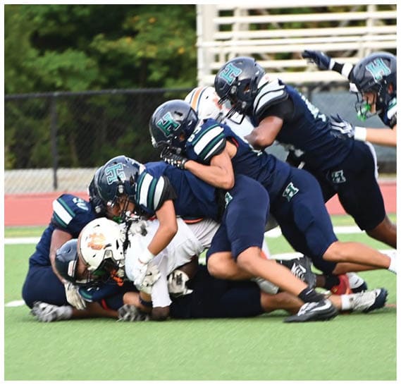 A group of football players celebrating a victory. AI generated content