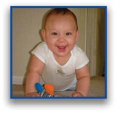 A smiling child wearing a white shirt is lying on the carpet and playing with a colorful stuffed toy. Description generated by AI