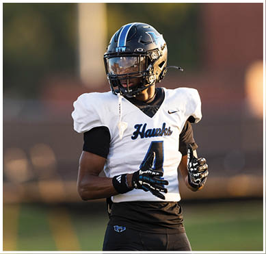 A football player wearing a blue jersey with the number 58 on it. Description generated by AI