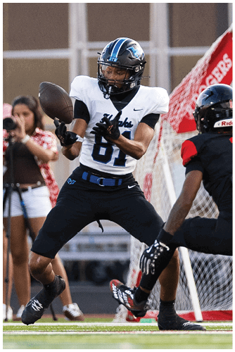 A football player is sliding on the ground. Description generated by AI