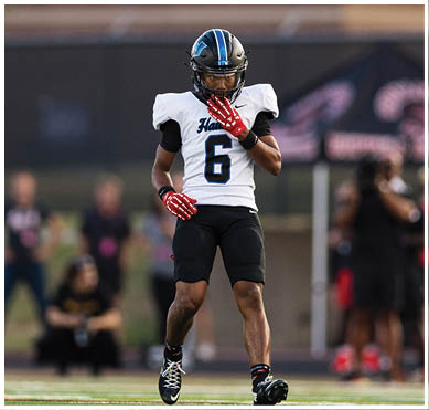 A football player wearing a blue jersey with the number 58 on it. Description generated by AI