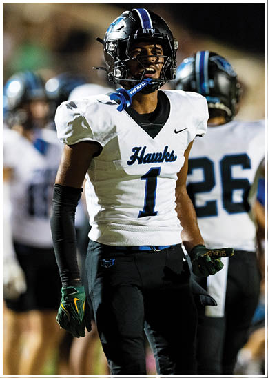 A football player wearing a blue jersey with the number 58 on it. Description generated by AI