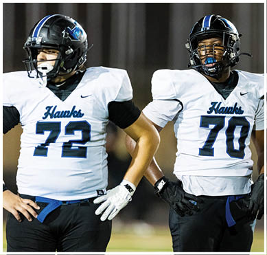 A football player wearing a blue jersey with the number 58 on it. Description generated by AI