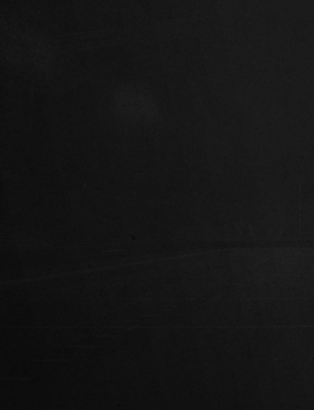 A dark textured surface with subtle vertical ridges and faint shadow patterns. Description generated by AI