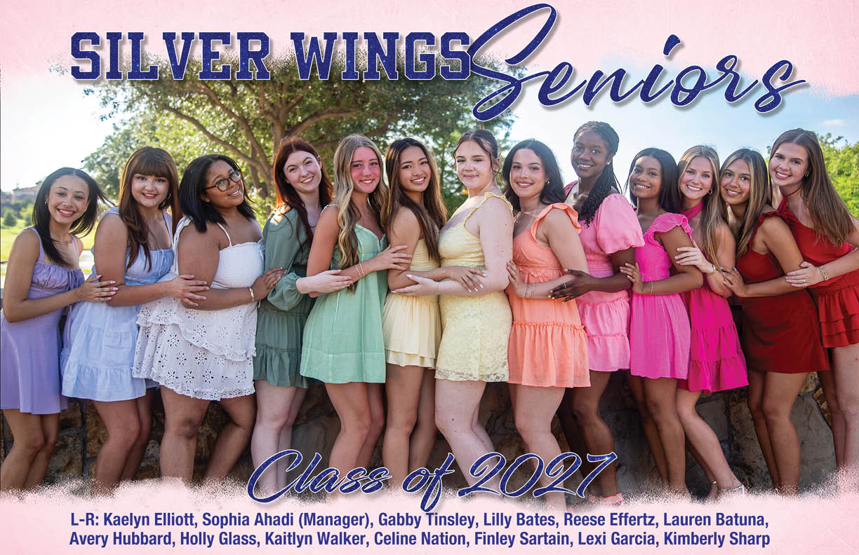 A group of adults dressed in colorful dresses stand closely together outdoors smiling with text above them reading Silver Wings Seniors Class of 2027. Description generated by AI
