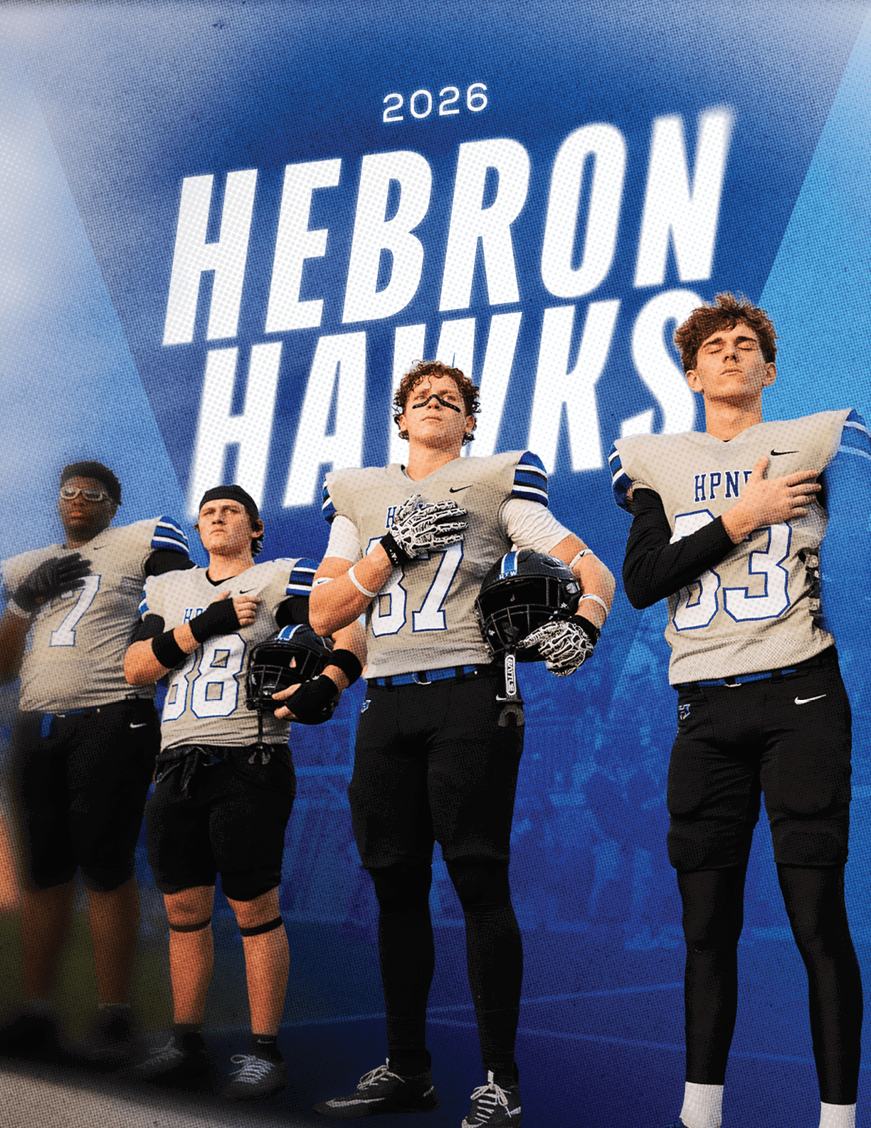 Four people in football uniforms stand confidently in front of a blue background with large white text reading “2026 Hebron Hawks." Description generated by AI