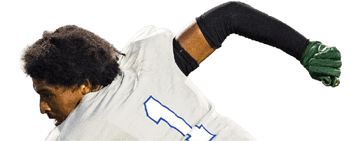 A person wearing a white sports jersey with the number one and a black long sleeve shirt underneath is captured mid-action with a green glove on one hand. Description generated by AI
