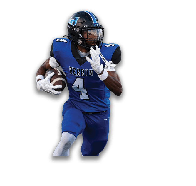 A person wearing a blue football uniform with the word “HEBRON" and the number 4 on the jersey is holding a football and appears to be preparing to throw it. Description generated by AI
