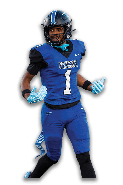 A person wearing a blue and black football uniform with the word “HEBRON" and the number one on the jersey is smiling and appears to be in motion. Description generated by AI
