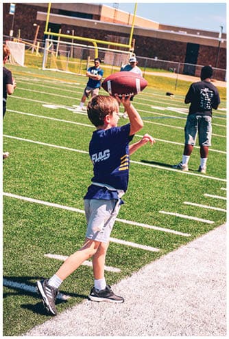 A football game is being played on a field. Description generated by AI