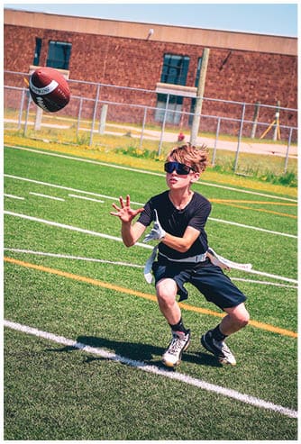 A football game is being played on a field. Description generated by AI