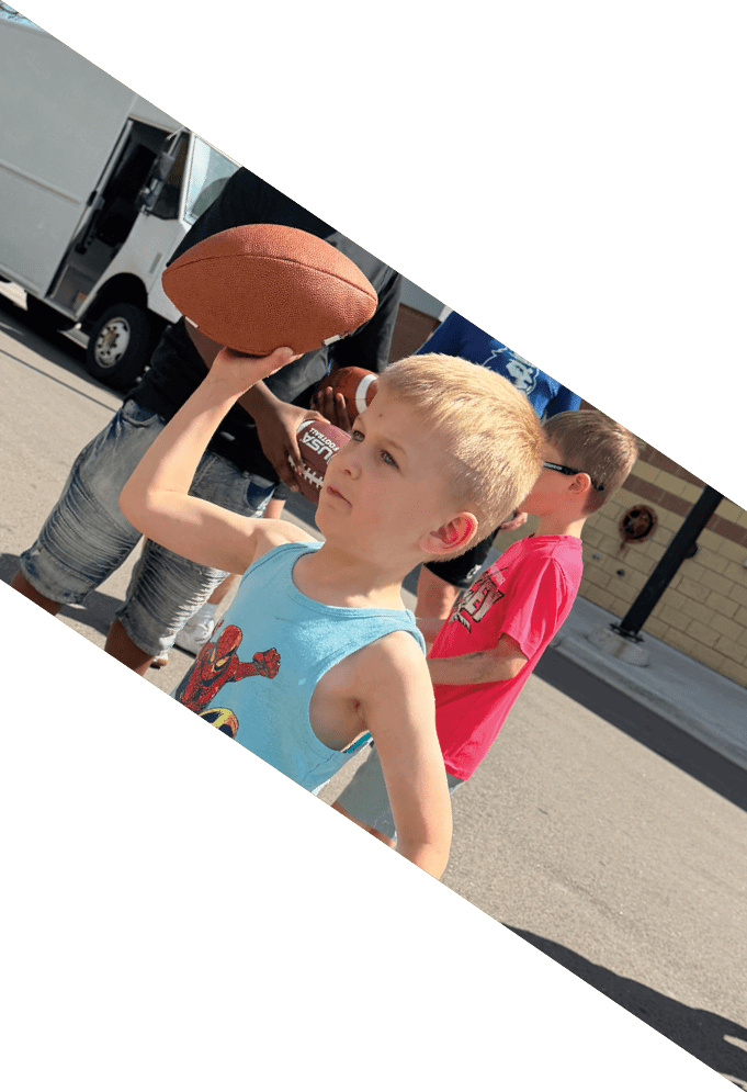 Four football players pose for a picture on the field. AI generated content