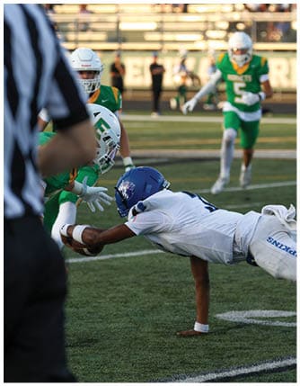 A football player running on the field. Description generated by AI