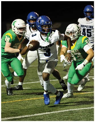 A football player running on the field. Description generated by AI