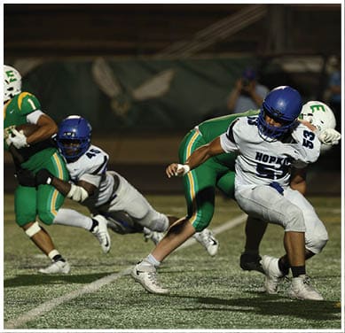 A football player running on the field. Description generated by AI