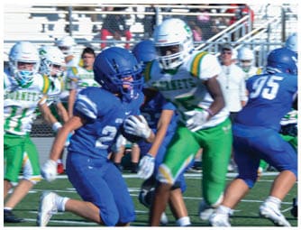 A group of football players on a field. Description generated by AI