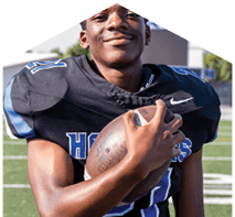 A young man wearing a white jersey with the number 10 on it. Description generated by AI