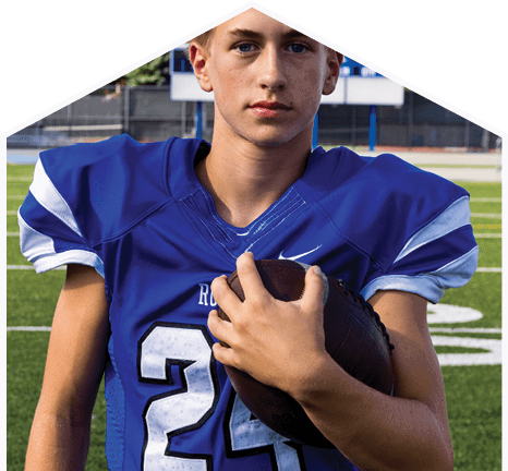 A young man wearing a white jersey with the number 10 on it. Description generated by AI
