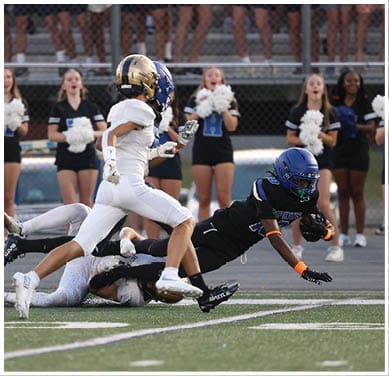 A football player running on the field. Description generated by AI