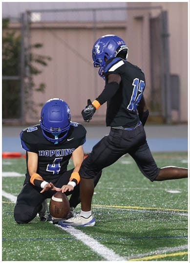 A football player wearing a blue jersey with the number 58 on it. Description generated by AI