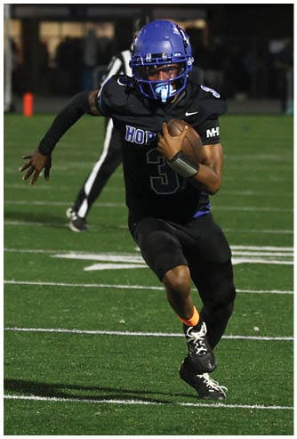 A football player running on the field. Description generated by AI