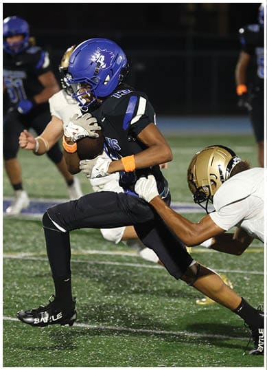 A football player wearing a blue jersey with the number 58 on it. Description generated by AI