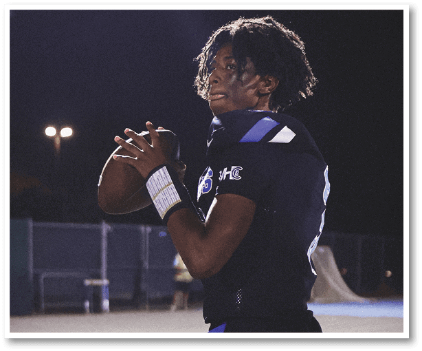 A group of football players wearing black jerseys with the number 3 on them. Description generated by AI