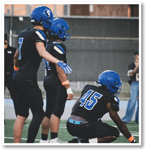 A group of men wearing black and white jerseys. Description generated by AI