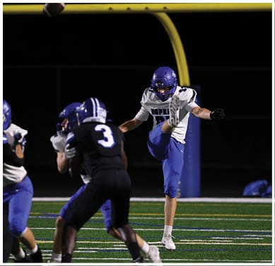 A football player running on the field. Description generated by AI