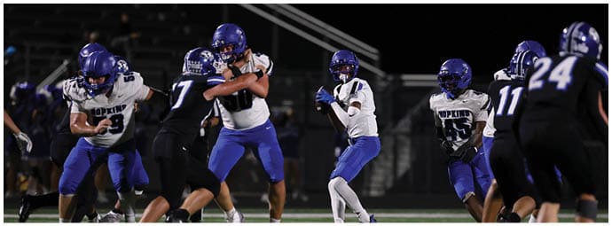 A football player is sliding on the ground. Description generated by AI