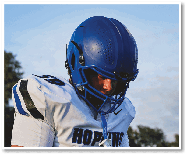 A group of football players wearing black jerseys with the number 3 on them. Description generated by AI