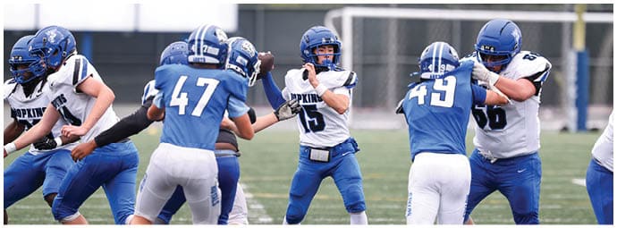 A football player is sliding on the ground. Description generated by AI