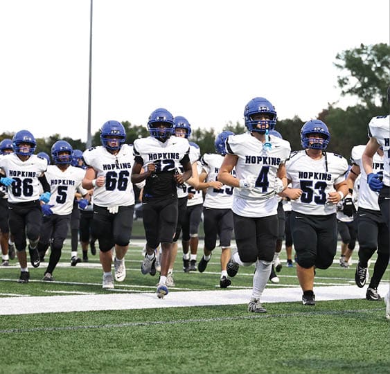 A group of football players celebrating a victory. AI generated content