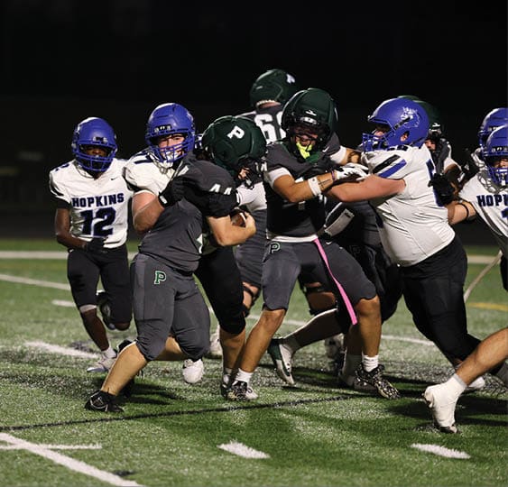 A group of football players celebrating a victory. AI generated content