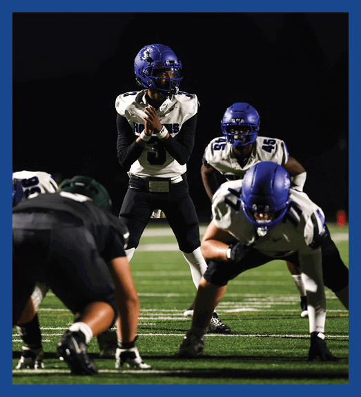 A football player in a white uniform is running with a football in his hand. AI generated content