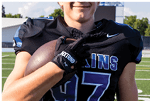 A young man wearing a white jersey with the number 10 on it. Description generated by AI