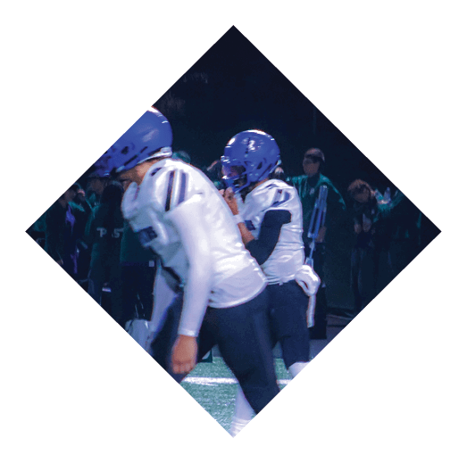 A football player wearing a black jersey with the number 16 on it is holding a football. AI generated content