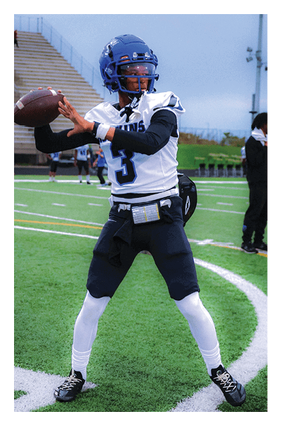 A young man wearing a football jersey with the name Vista on the back. AI generated content