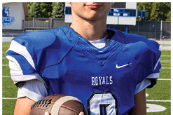 A young man wearing a white jersey with the number 10 on it. Description generated by AI