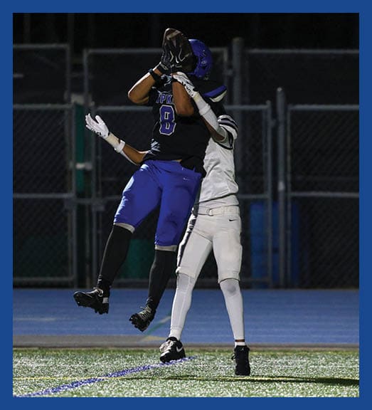 A football player in a white uniform is running with a football in his hand. AI generated content