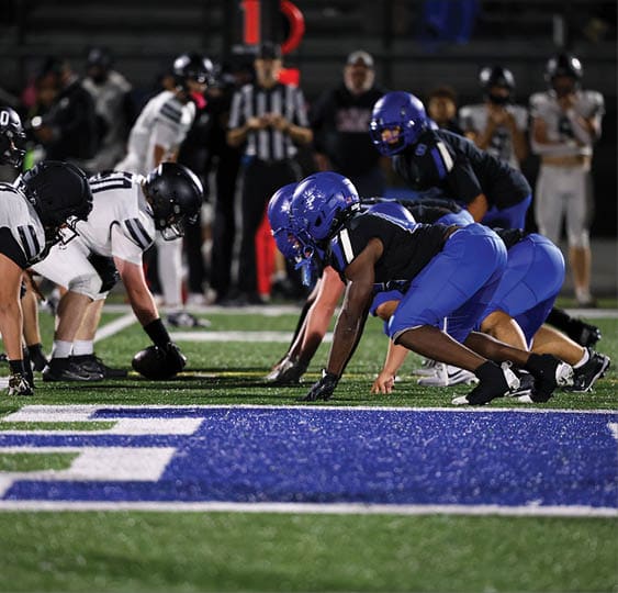A group of football players celebrating a victory. AI generated content