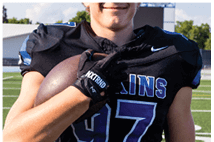A young man wearing a white jersey with the number 10 on it. Description generated by AI
