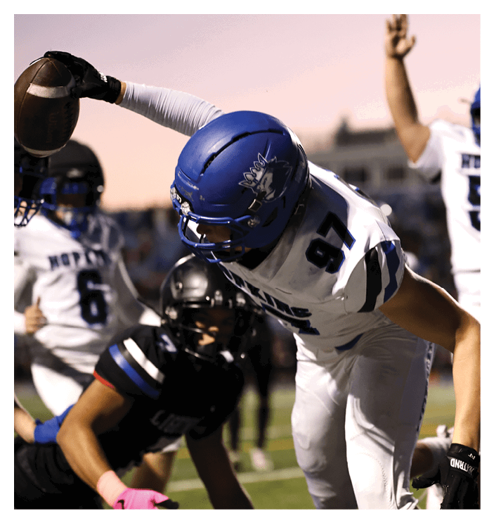 A group of football players walking on the field. AI generated content