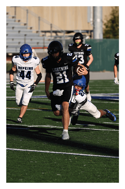 A young man wearing a football jersey with the name Vista on the back. AI generated content