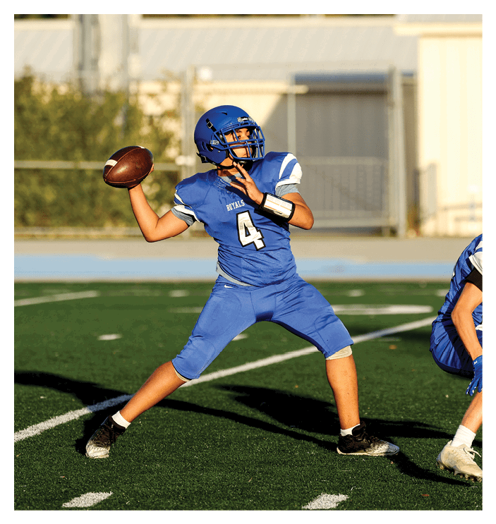 A group of football players walking on the field. AI generated content