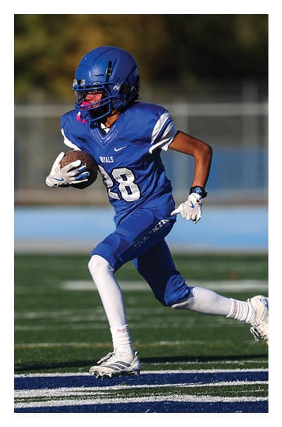 A young man wearing a football jersey with the name Vista on the back. AI generated content
