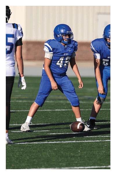 A football player wearing a black and white uniform with the number 10 on the back. AI generated content