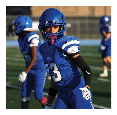 A football player in a white jersey with the number 85 on it is trying to catch a football. AI generated content