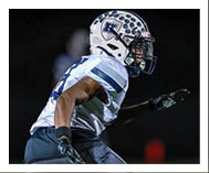 Two football players wearing black jerseys and holding hands. Description generated by AI