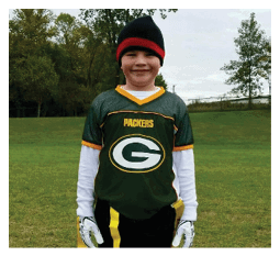 Two football players wearing black jerseys and holding hands. Description generated by AI